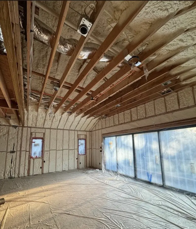 Interior walls and ceiling insulated with spray foam during new construction in Cresskill